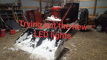 Farmall M plowing snow