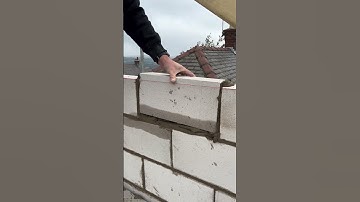 The process of installing concrete bricks to make house walls #shorts