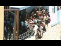 Italian police beat migrants in Lampedusa clashes
