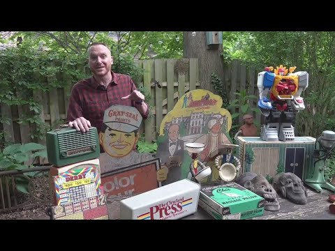 Mike Polk Jr. checks out the garage sale at longtime Big Fun owner's house in Cleveland Heights