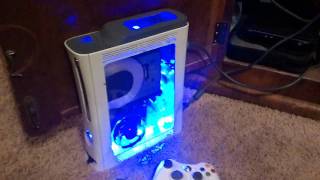 Two Custom Xbox 360's ( plexiglass window, hard drive mod, cut dvd drive, lots of led's, console))