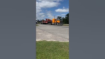 Orange Peterbilt Flat top 379 pullin a stepdeck Rollin