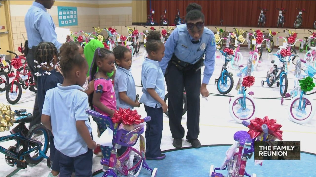 St. Louis police present students at elementary school with new bike, helmet