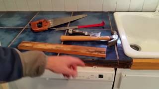 Replacing wood molding around kitchen counter tile