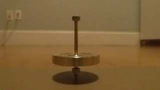 Electric Spinning Top on Low Friction Surface Spins 6:30. Wobbles 0:05. MOST PERFECT VERTICAL