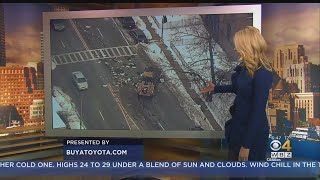 Trash Truck Spills Garbage Over Dorchester Street At Start Of Rush Hour