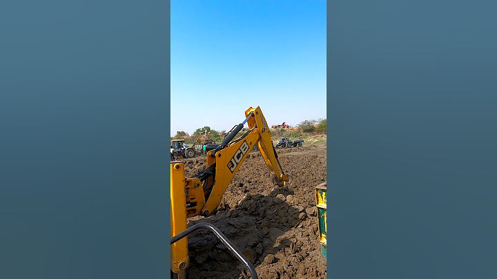 JCB 3DX LOADING MUD IN TRACTORS