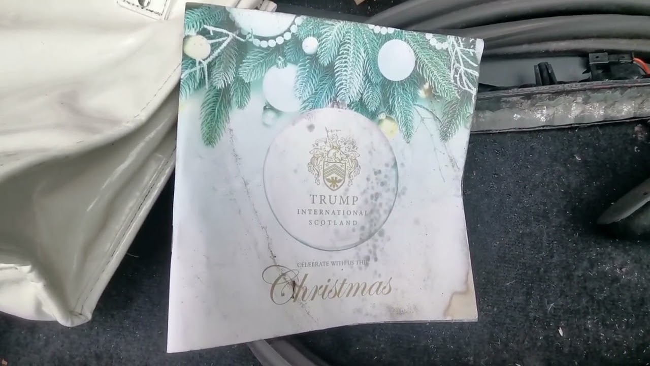 Donald trump golf course christmas menu in boot of scrapyard car