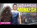 Behind the counter at the only japanese monkfish restaurant in tokyo