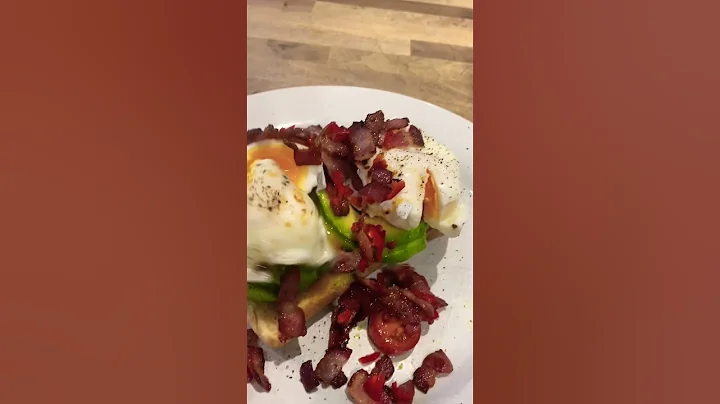 Poached eggs on tiger bread toast with avocado, fr...
