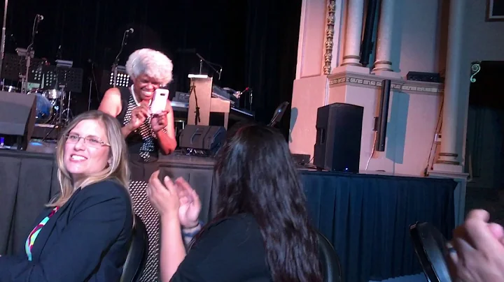 Emcee Dr. Sherry Perkins raps at the A.J. Moore Al...