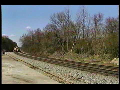 At 11:58am on Saturday, March 2, 1996, eastbound intermodal train #220 rumbles through the milepost 138.0H grade crossing in Mableton, Georgia, on NS's Atlanta North District behind KCS GP40-2 #4758, NS GP38-2 #5050, NS SD40-2 #6088, and NS GP38-2 #5049. The RS5T airhorn on the #4758 sure did sound good!