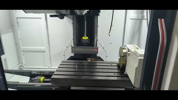 CNC milling machine with 4th axis, robotic arm for tool change