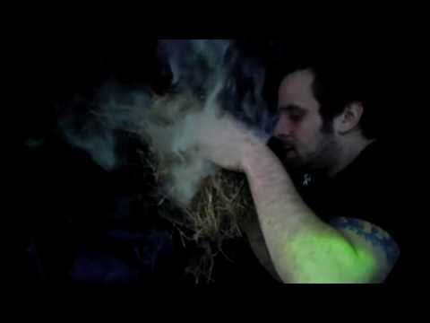Bow drill ember blown into flame