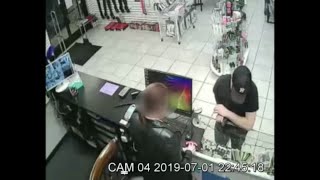 Caught on Camera: Man pulls gun, steals money from adult video store.