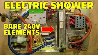 Inside a vintage electric shower with bare 240V elements in the water