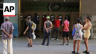 Long lines in front of banks and ATMs as Cubans face another hurdle to their difficult daily routine