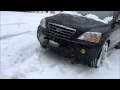 Subaru Outback helps out stuck KIA in snow