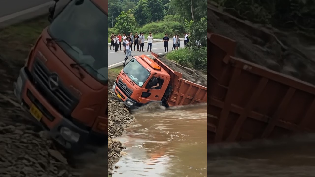 The truck overturns and falls into the water. 