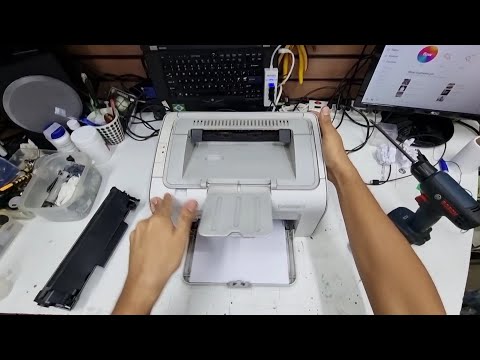 Vídeo: Como faço para limpar minha impressora HP 1005?