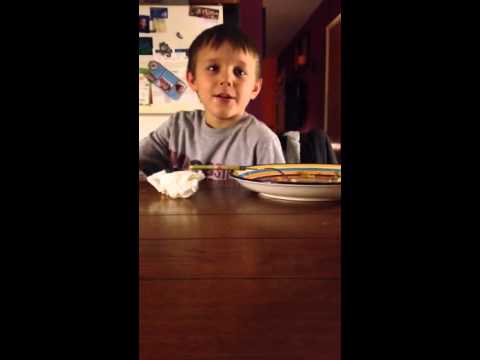 boy-laughing-hysterically-at-the-dinner-table