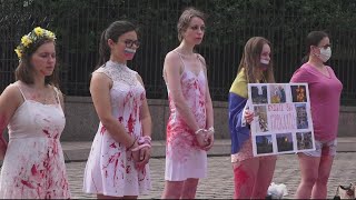 Activists outside Russian Embassy claim Russia is using 'rape as a weapon of war'