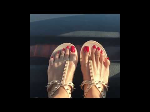 Damn hot feet with adorable red nails dangling