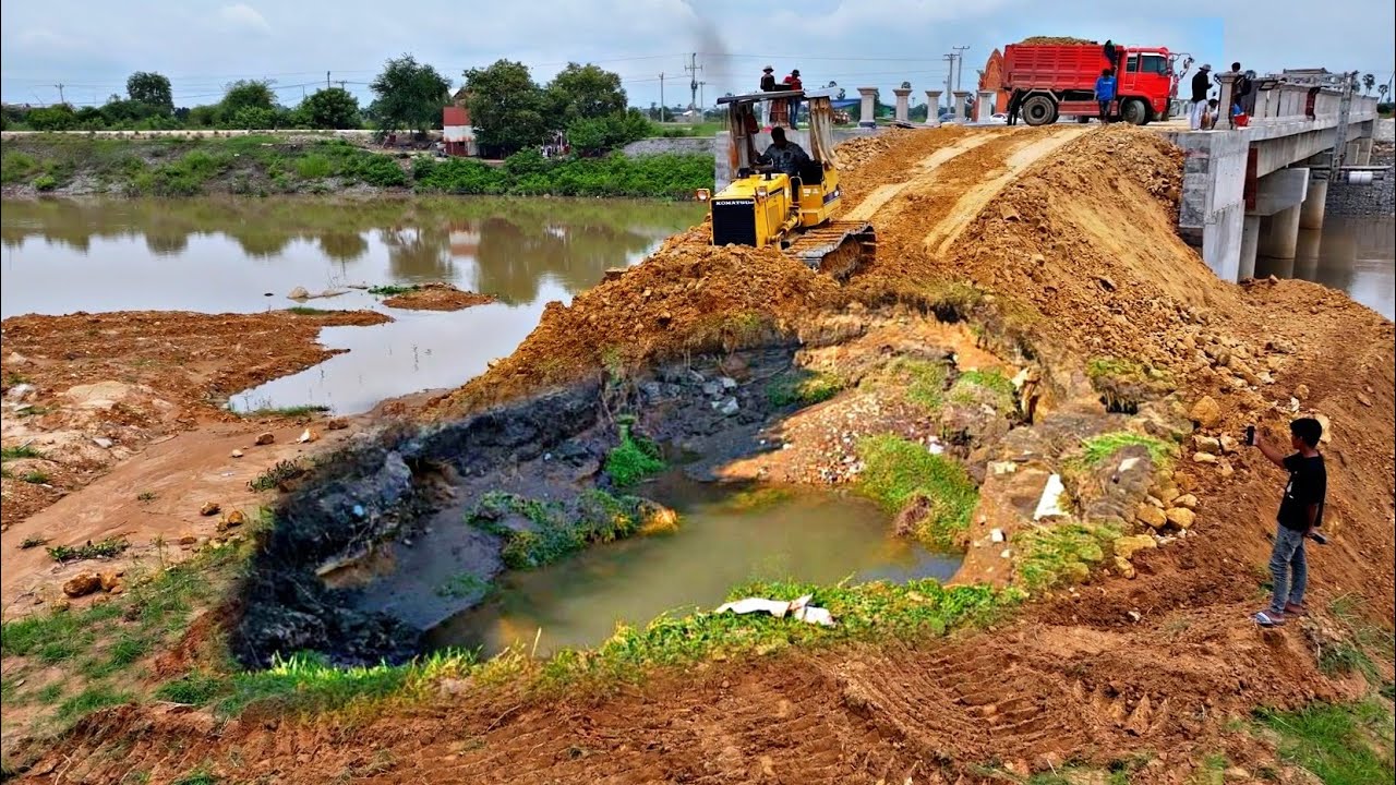 Very good work.!! On both sides of the bridge, construction sites for earthworks, rock filling,