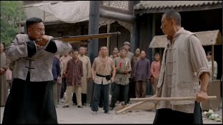 The bully kicks an old man in the street, but encounters a kung fu master. He's beaten hard.