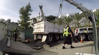 Backing up fail! Rotators lift loaded Super 10 that broke and fell through a driveway