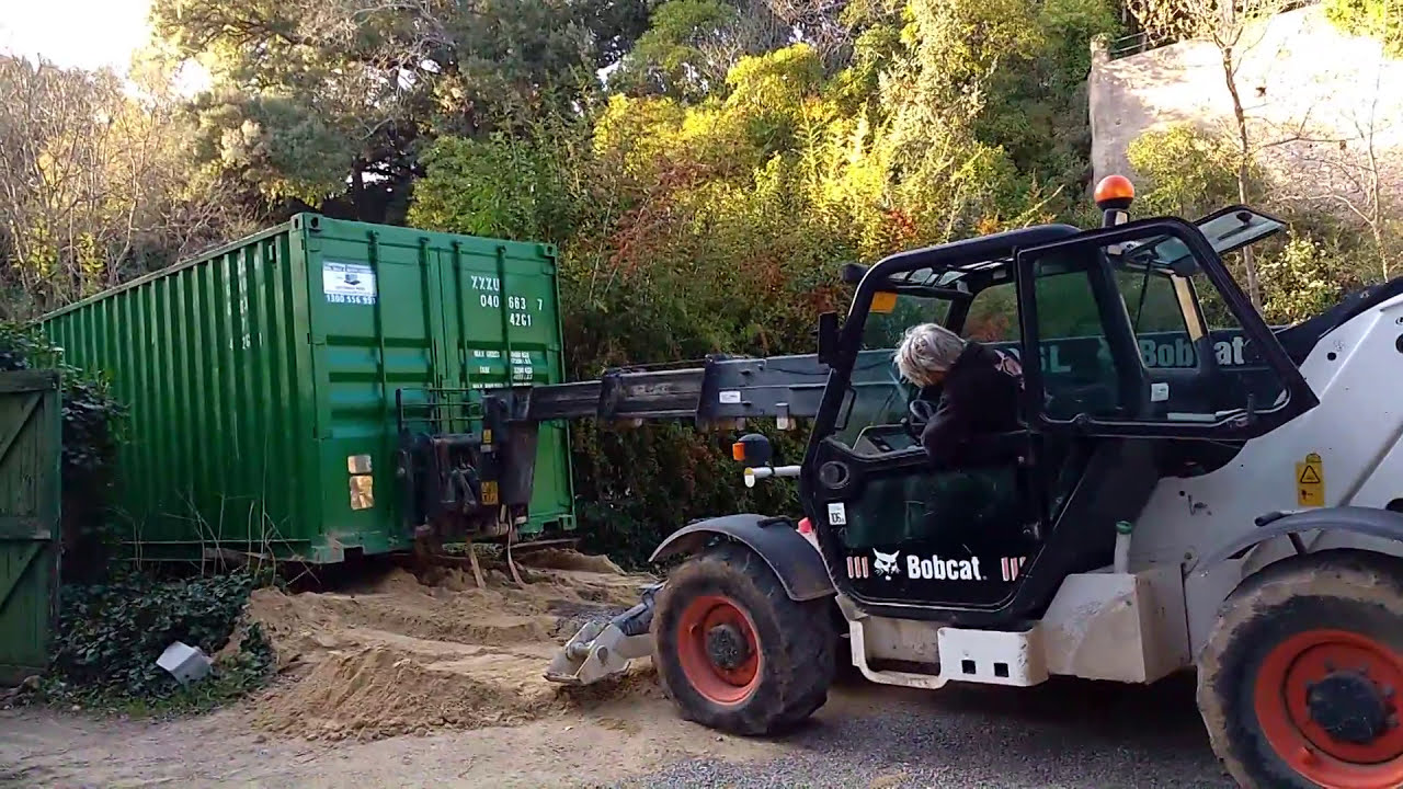 Bobcat vs. 40ft shipping container YouTube