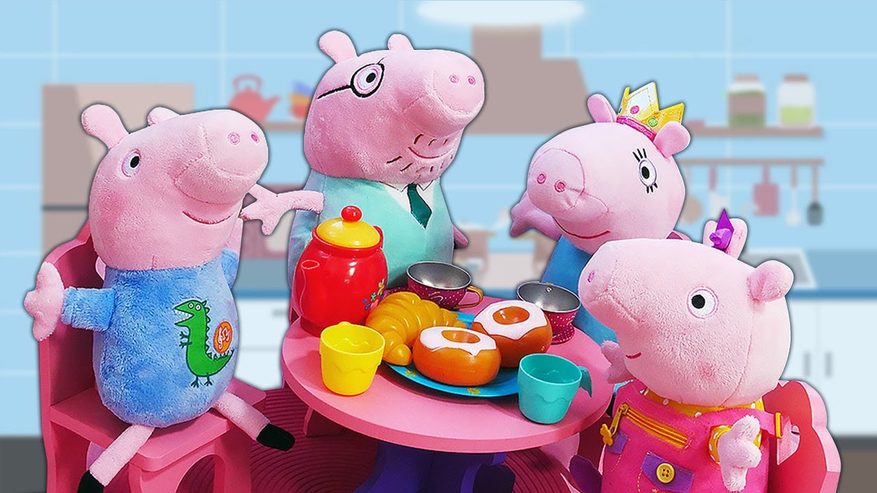 Familia Peppa Pig en marionetas de peluche.