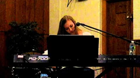 Rachel singing "Never Alone"