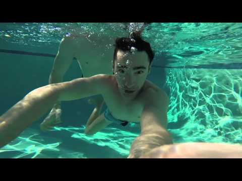 Gay couple In the pool at Inndulge in Palm Springs