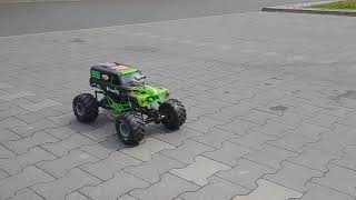 Maverick Strada E30 RC and Axial Grave Digger drift on parking lot