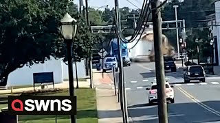 Moment truck stuck on railroad crossing gets smashed to pieces by oncoming train | SWNS