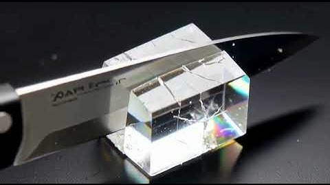 Super-sharp knife slicing minerals—obsidian, quartz, sapphire—showing authentic cleavage and texture