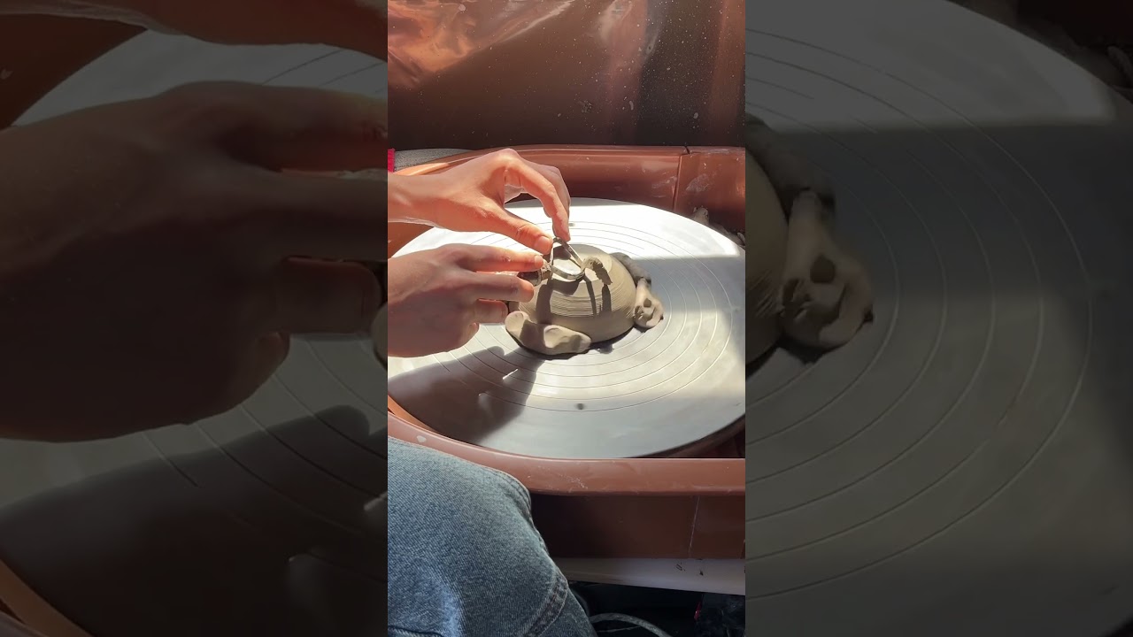 Trimming a small bowl on the pottery wheel- This is yet another installation in my dinnerware set!