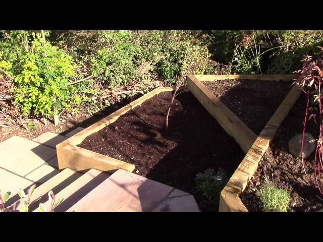 garden landscaping Edinburgh project - notice stone steps and angular wooden raised beds.