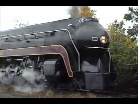 I had previously thought my August '94 footage from Horseshoe Curve was the oldest tape I had...I was wrong. It's this tape, the last trip I took behind Norfolk & Western class J 4-8-4 611, dated October 30, 1993, and as it turned out it was also the last trip I took before Norfolk Southern's steam program was cancelled. The trip was put on by the Piedmont Carolinas Chapter of the NRHS and ran from Charlotte, NC to Toccoa, GA. I rode many of the chapter's trips between 1984 and 1993, but unfortunately all of them except this one predated my or my friend's ownership of a video camera. By the time I bought my Handycam in '96 the steam program was long gone, so the clips from this tape are the only surviving personal footage I have of the 611 under steam. The weather was gloomy but it wasn't about to stop me from filming the 611 as her crew went about the business of preparing her for the return trip from Toccoa. After topping off the coal and water, 611 gingerly pulled the train forward to turn on a wye. For the reverse move through the second leg of the wye, NS employed a Geep to pull the train through tail end first, which is where part 2 picks up.