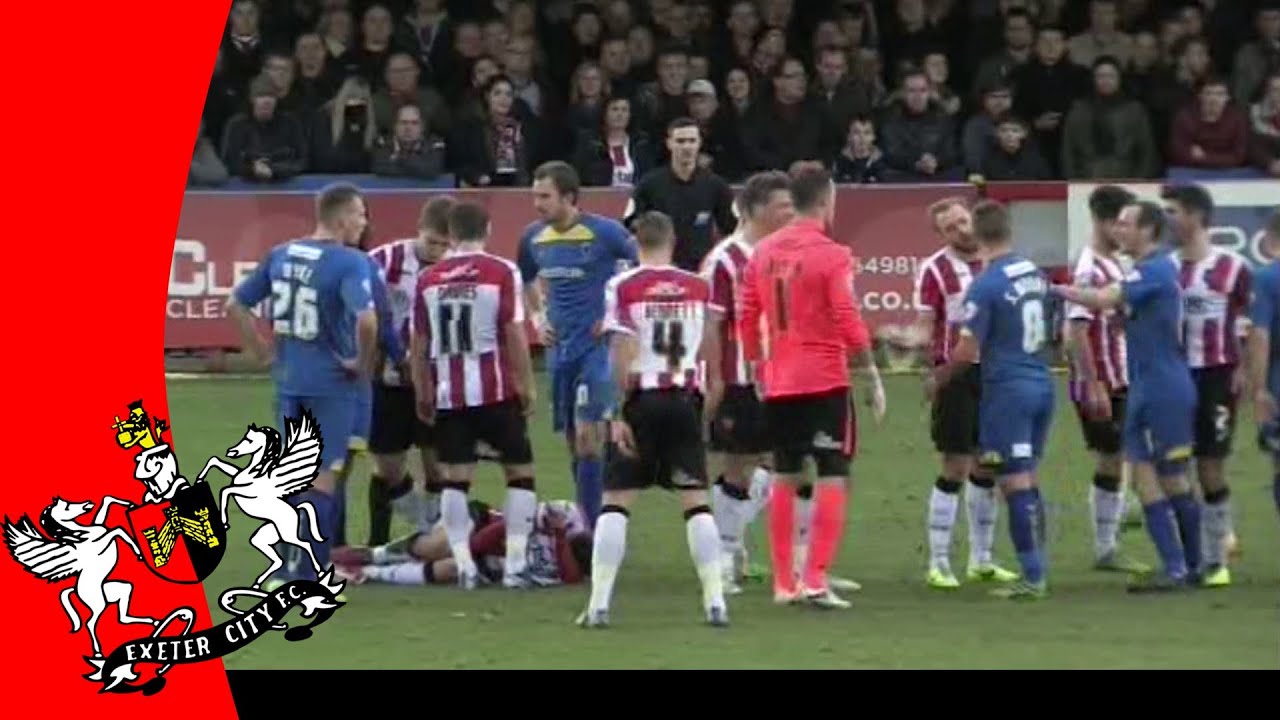Matt Grimes tackled by AFC Wimbledon's Sammy Moore | Exeter City Football Club football score