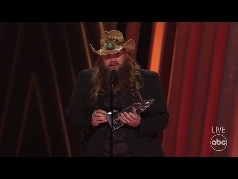 Chris stapleton accepts the award for male vocalist of the year at cma awards 2022 - the cma awards