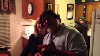 Parents singing "Tiny Bubbles"