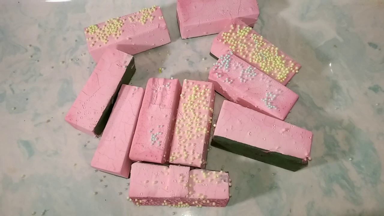 Unsoaked wet floral foam covered in pink clay