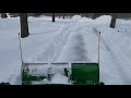 John Deere 1025R Mauser Cab Plowing a Foot of Snow