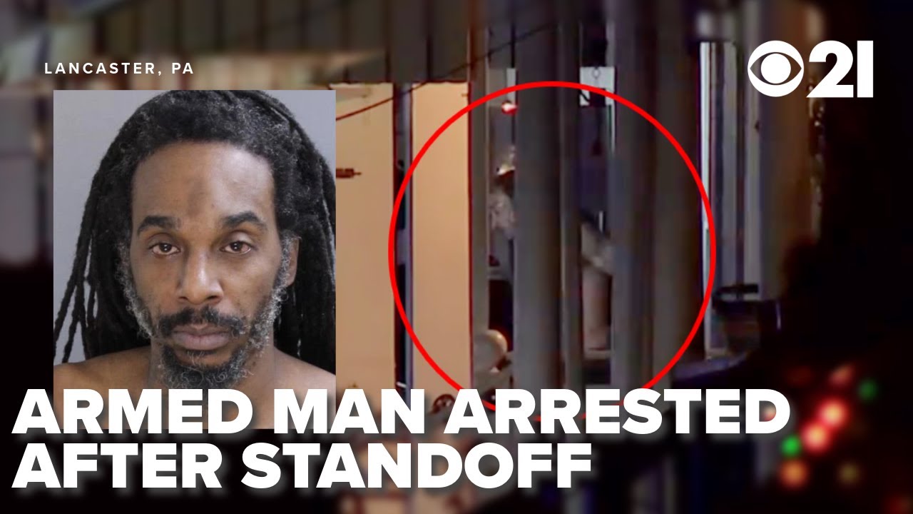 Armed standoff suspect arrested after barricading self in home ...