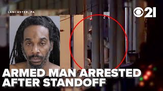 Armed standoff suspect arrested after barricading self in home following domestic incident