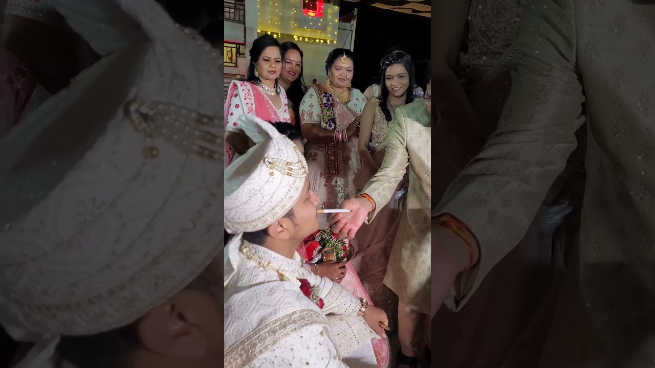 Bride's parents welcome groom at wedding by lighting a cigarette for him