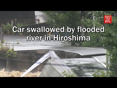 Car swallowed by flooded river in Hiroshima