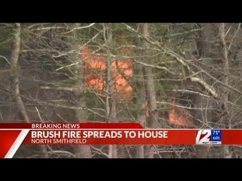 Flames from brush fire spread to North Smithfield home - YouTube